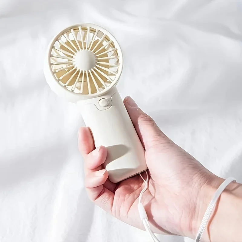 Mini Ventilateur Portable:  Léger, Silencieux & Rechargeable – Format de Poche