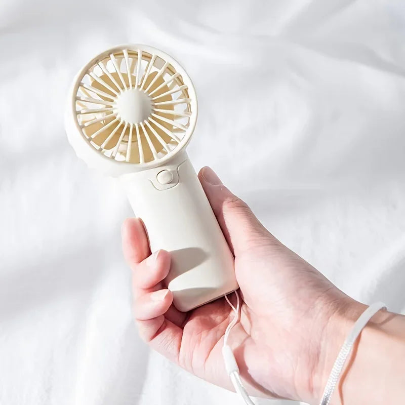 Mini Ventilateur Portable:  Léger, Silencieux & Rechargeable – Format de Poche